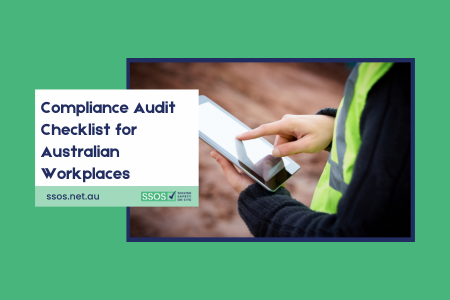 Construction worker reviewing compliance audit checklist on an Australian construction site